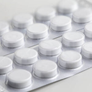 Blister pack of white tablets, representing medications available for purchase at Combat Medic Wellness.